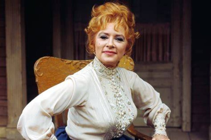 Amanda Blake "Kitty" and Milburn Stone "Doc" are greeted by Miss