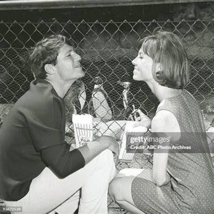 Chris Connelly and Patricia Morrow ride a bike. Bike, Bike rider