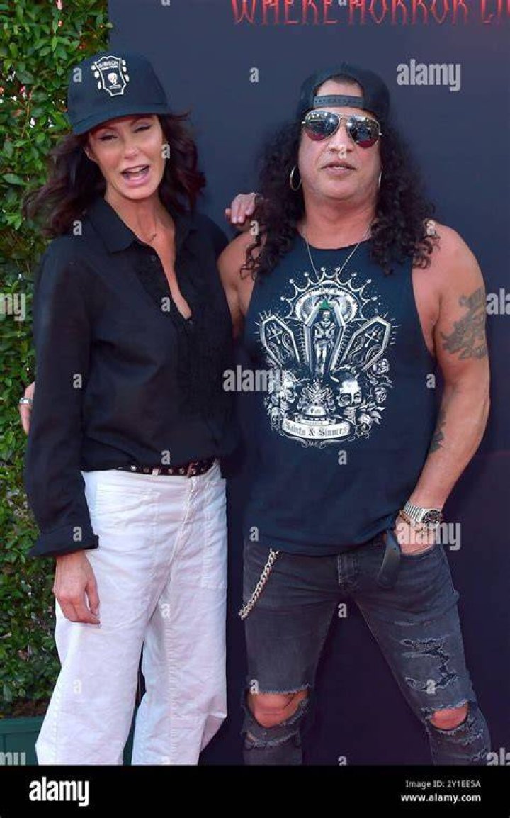 (LR) Meegan Hodges and Slash arrives at the Universal Studios