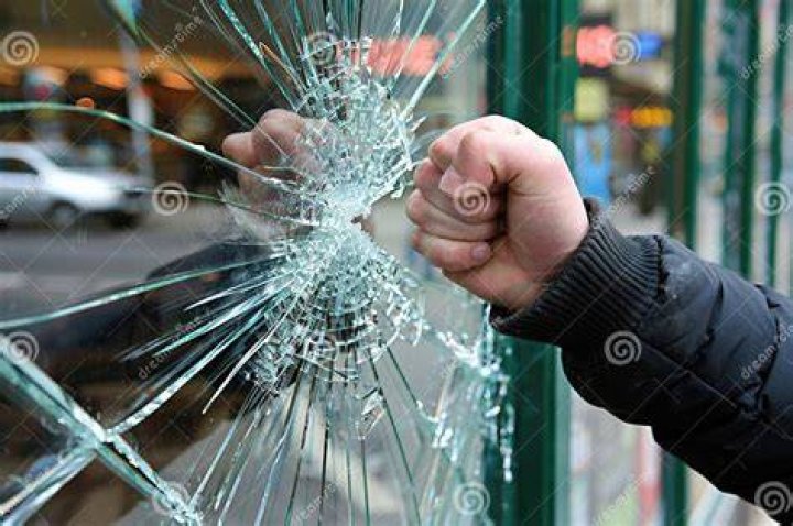 Unraveling "Who Is The Guy Punching The Window"